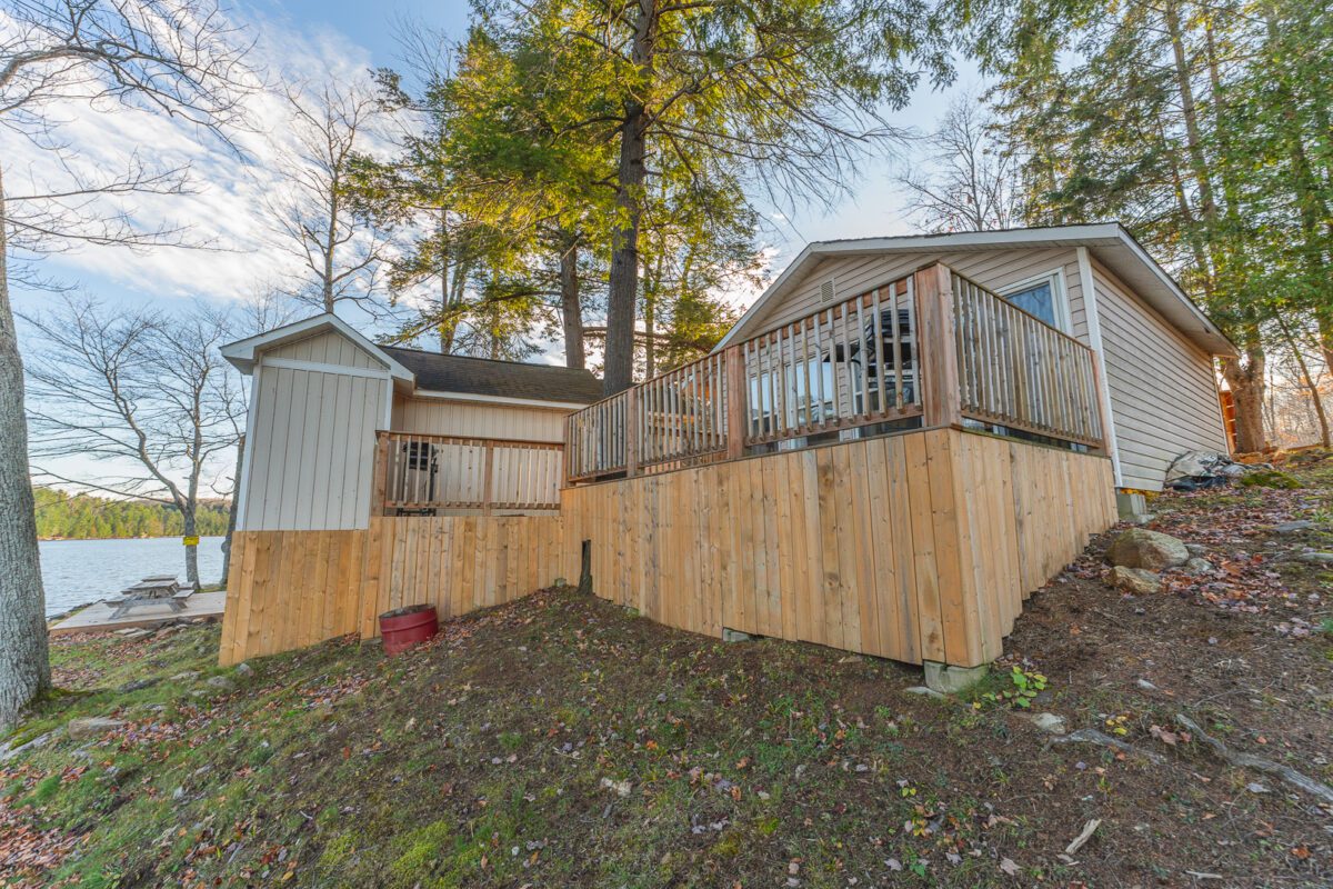 Rear exterior and raised lakefront deck of Cabin 11